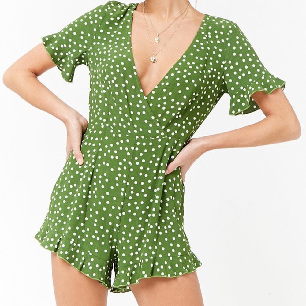 Green romper with white polka dots